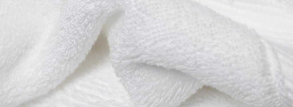 macro photograph of eco-friendly bath towel in pearl white 